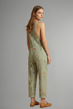 Women's wide leg jumpsuit in green with square neckline and adjustable straps