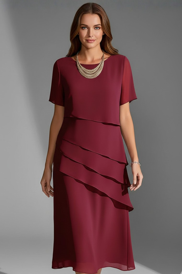 Women's short sleeve dress with layered front panel and straight knee-length hem