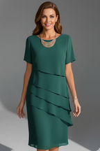 Women's short sleeve dress with layered front panel and straight knee-length hem