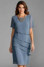 Women's short sleeve dress with layered front panel and straight knee-length hem