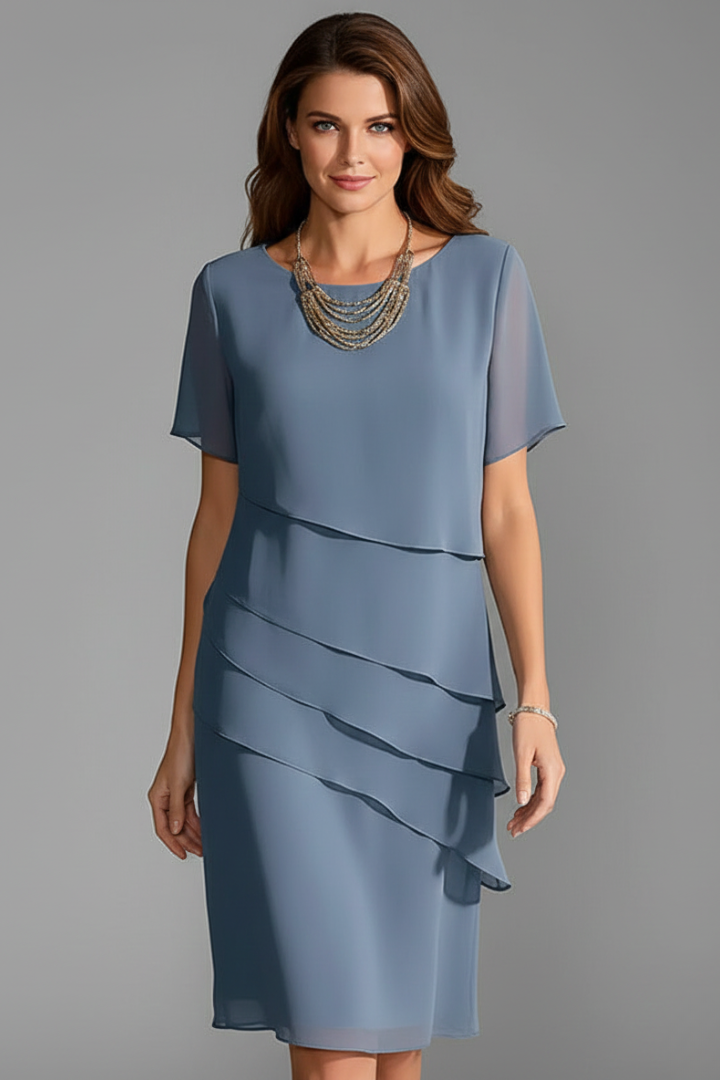Women's short sleeve dress with layered front panel and straight knee-length hem
