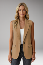 Women's sleeveless blazer with notch collar and flap pockets, structured tailored fit