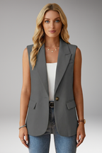 Women's sleeveless blazer with notch collar and flap pockets, structured tailored fit