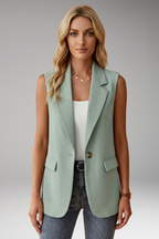 Women's sleeveless blazer with notch collar and flap pockets, structured tailored fit