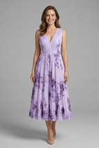 Women's sleeveless V-neck dress with pleated midi skirt and all-over printed pattern