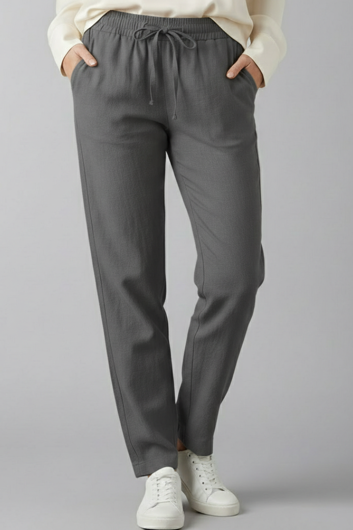Women's trousers with elastic waist, side pockets and tapered ankle length