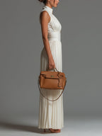 Women's white wide-leg jumpsuit with deep V-neck and sleeveless cut