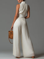 Women's white wide-leg jumpsuit with deep V-neck and sleeveless cut