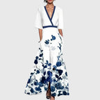 Women's spring floral dress with flared skirt and waist belt, available in red, white and green