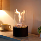Decorative ethanol oil lamp with metal frame, glass cylinder, and decorative stones, indoor and outdoor