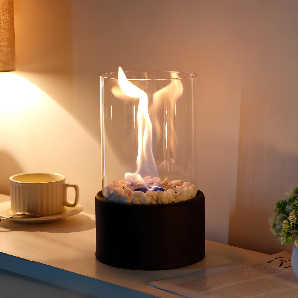 Decorative ethanol oil lamp with metal frame, glass cylinder, and decorative stones, indoor and outdoor