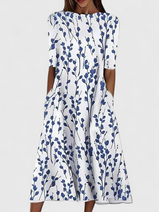 Women's floral midi dress with round neckline, stretchy fabric, available in blue and green