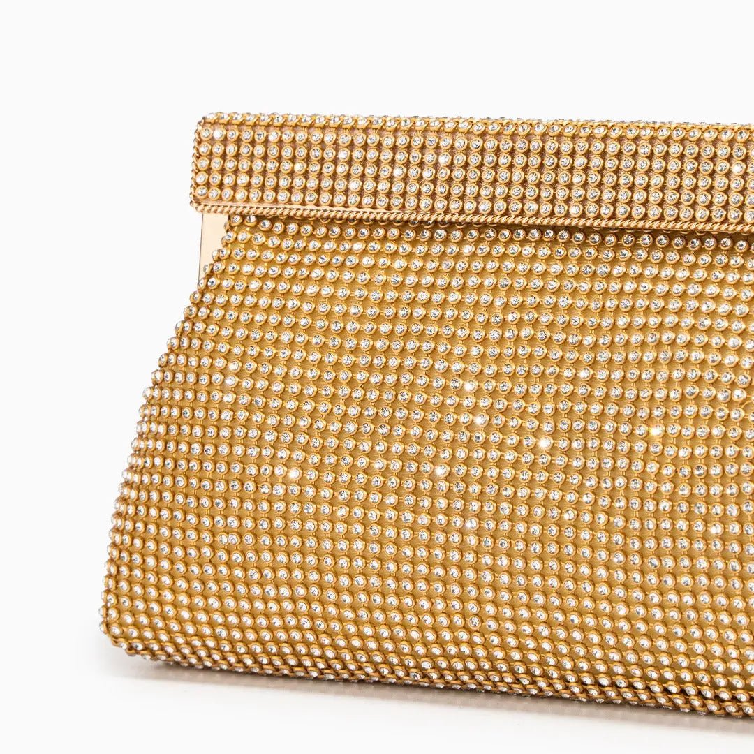 Gold evening clutch bag with crystal embellishments and snap closure