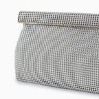 Gold evening clutch bag with crystal embellishments and snap closure