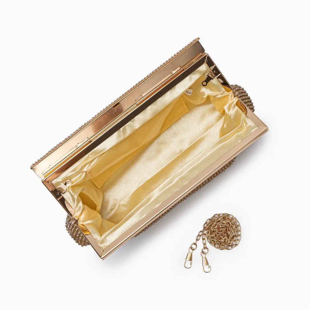 Gold evening clutch bag with crystal embellishments and snap closure
