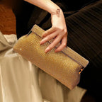 Gold evening clutch bag with crystal embellishments and snap closure