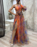 Evening maxi dress one-shoulder with floral appliqué and high leg slit