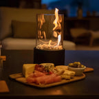 Decorative ethanol oil lamp with metal frame, glass cylinder, and decorative stones, indoor and outdoor
