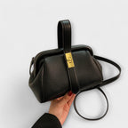 Women mini crossbody bag with twist lock closure in faux leather