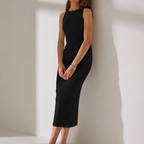 Sleeveless fitted midi dress with subtle ripple texture, available in white and black