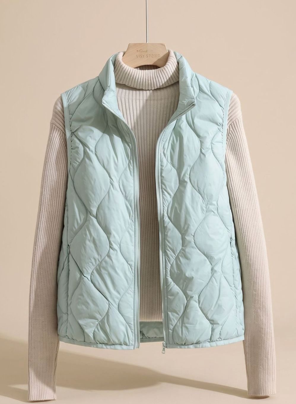 Women's quilted puffer vest with stand collar, sleeveless design, sizes M to 4XL