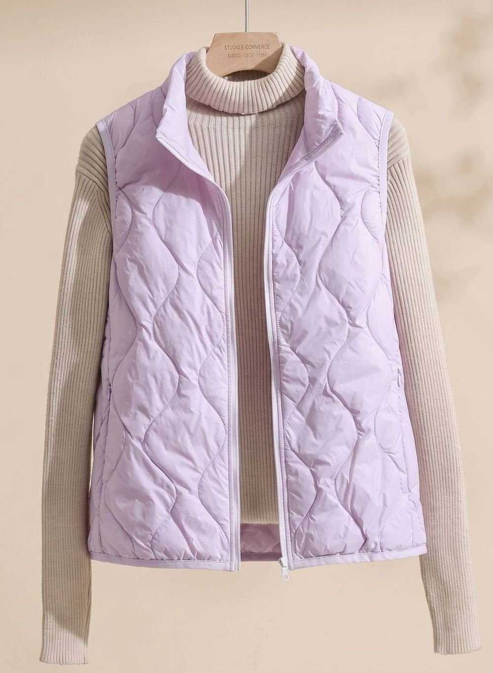 Women's quilted puffer vest with stand collar, sleeveless design, sizes M to 4XL