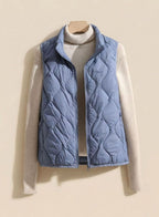Women's quilted puffer vest with stand collar, sleeveless design, sizes M to 4XL