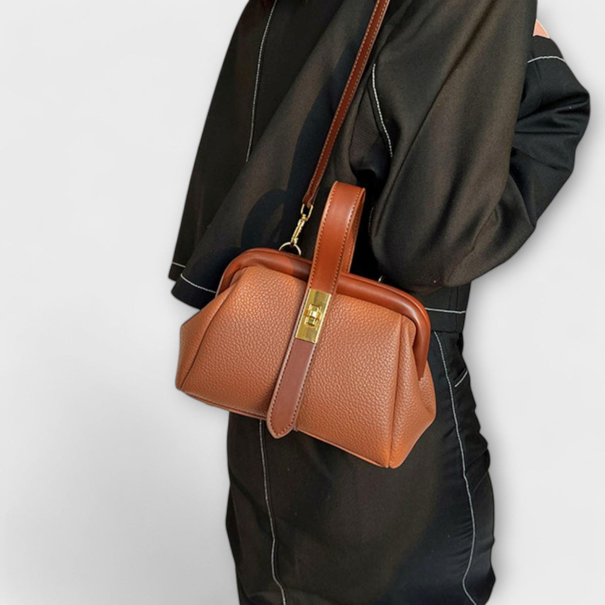 Women mini crossbody bag with twist lock closure in faux leather