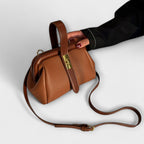 Women mini crossbody bag with twist lock closure in faux leather