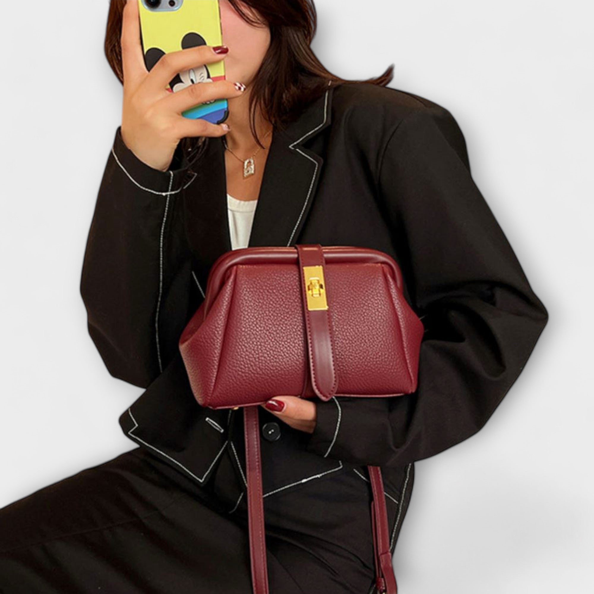 Women mini crossbody bag with twist lock closure in faux leather