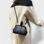 Women mini crossbody bag with twist lock closure in faux leather