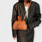 Women mini crossbody bag with twist lock closure in faux leather