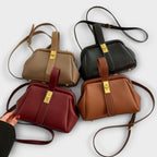 Women mini crossbody bag with twist lock closure in faux leather