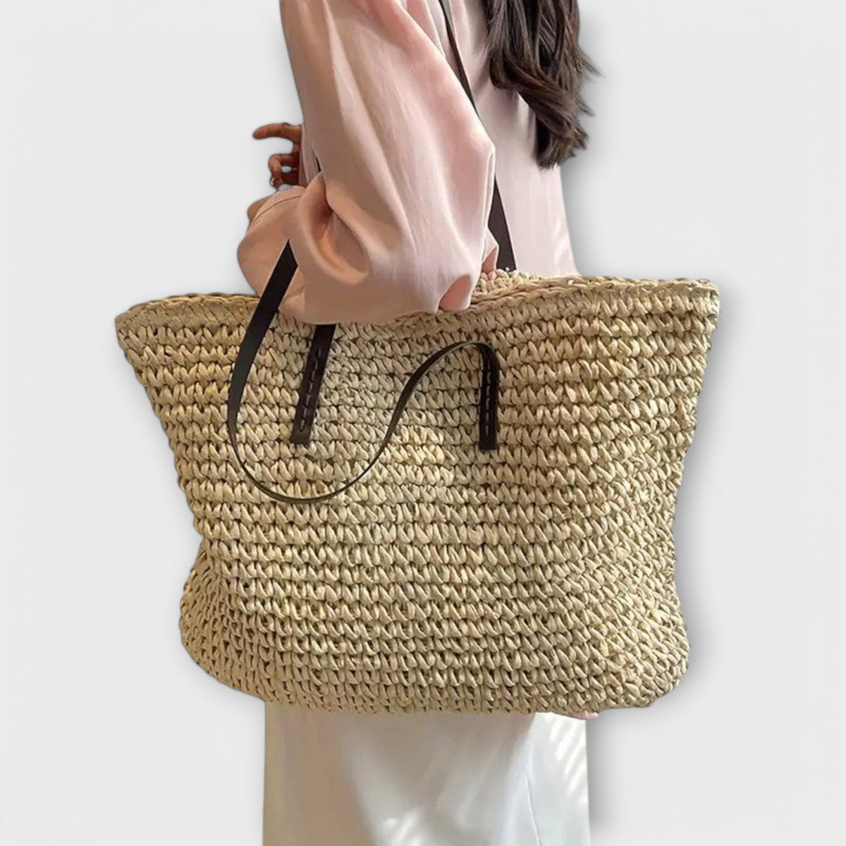 Women woven straw shoulder bag with firm top handle in natural texture