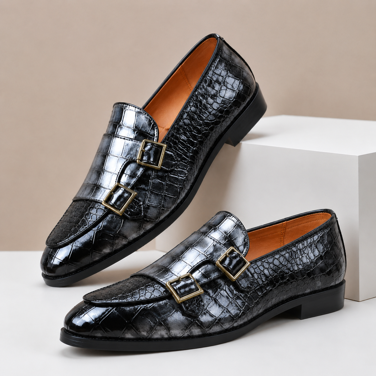 Men's leather loafers with double monk strap buckles and almond toe, crocodile-embossed finish