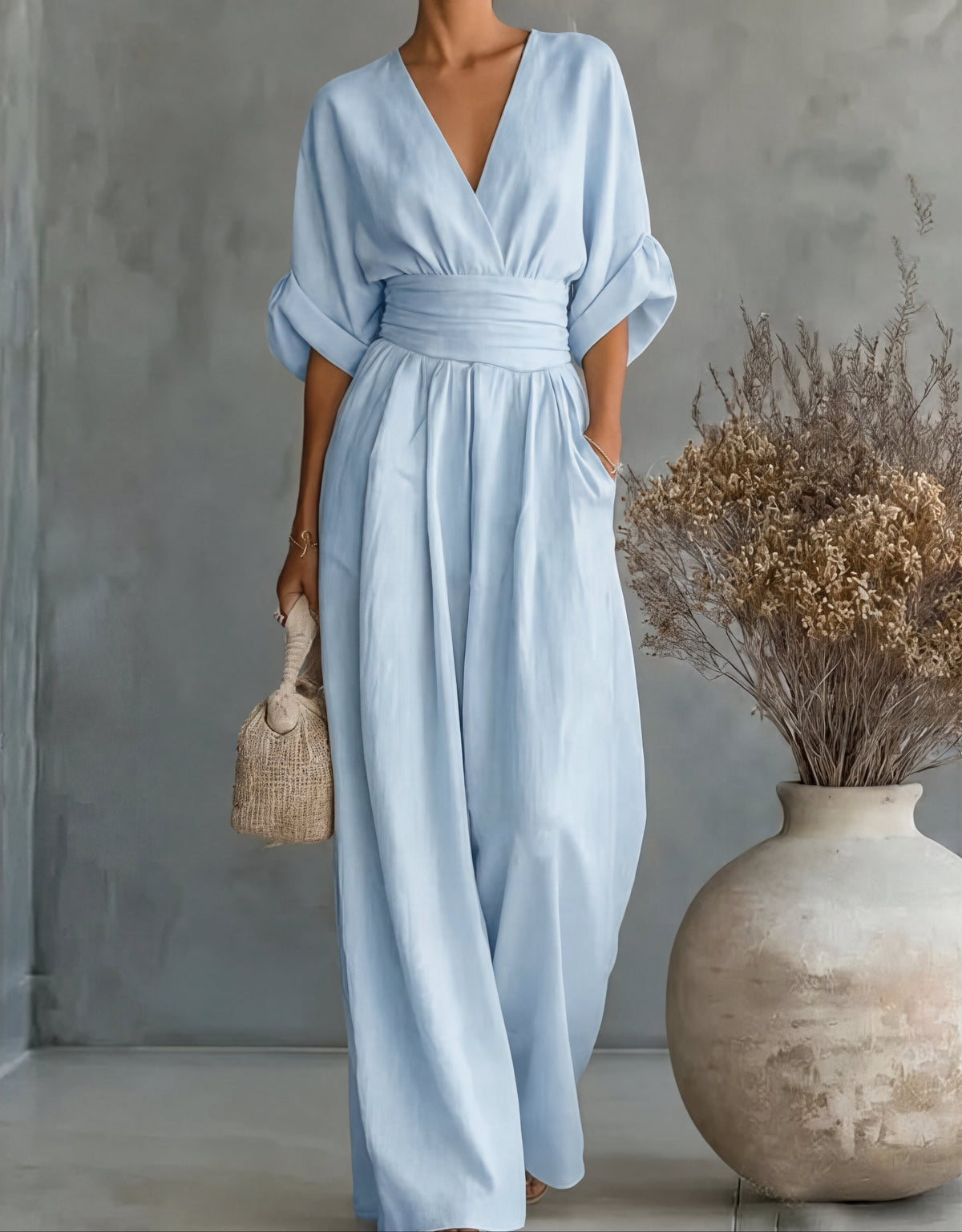 Women's wide-leg jumpsuit with V-neck and belted waist, elegant occasion wear