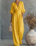 Women's wide-leg jumpsuit with V-neck and belted waist, elegant occasion wear