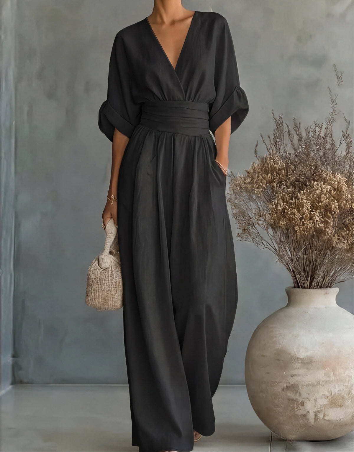 Women's wide-leg jumpsuit with V-neck and belted waist, elegant occasion wear