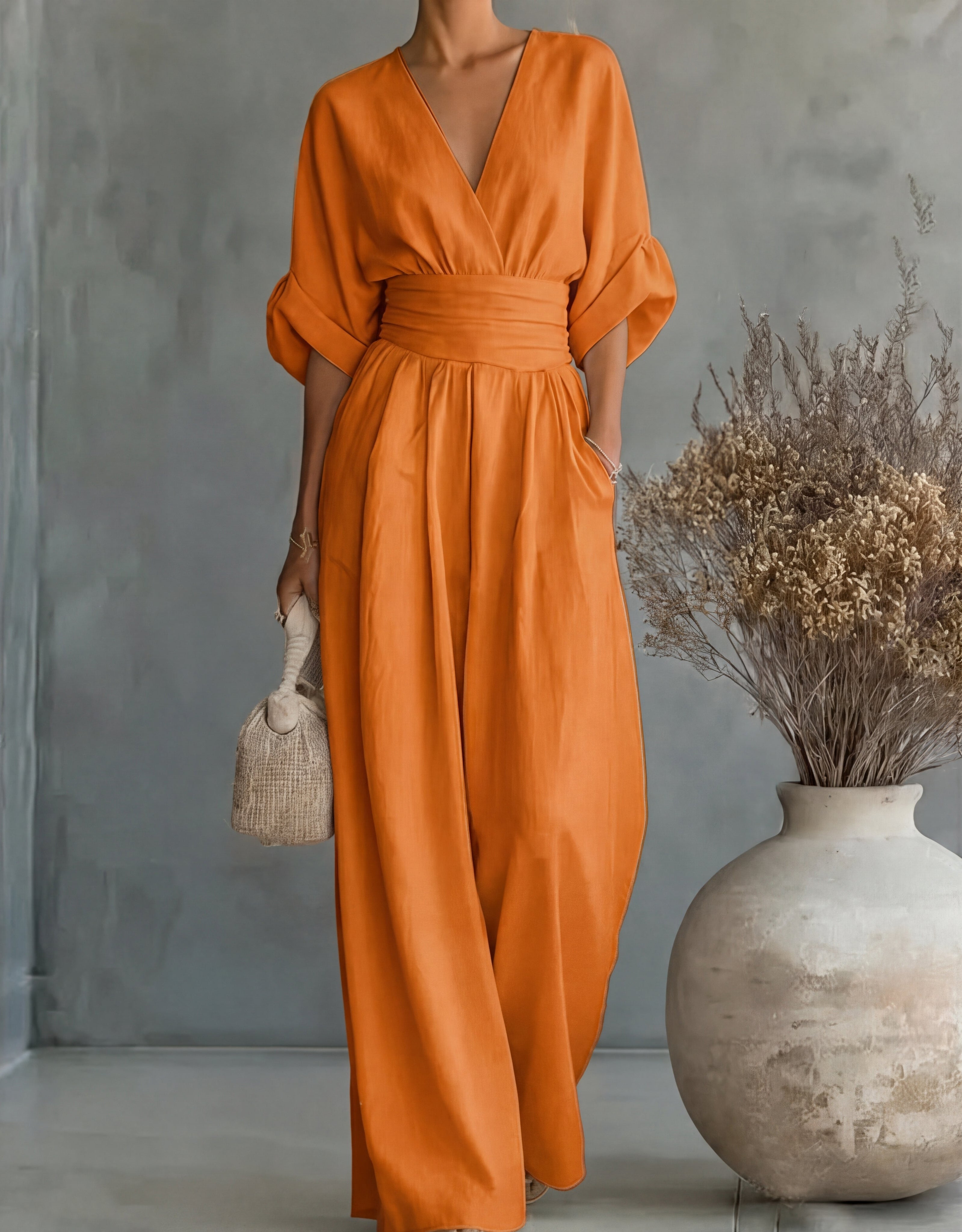 Women's wide-leg jumpsuit with V-neck and belted waist, elegant occasion wear