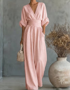 Women's wide-leg jumpsuit with V-neck and belted waist, elegant occasion wear