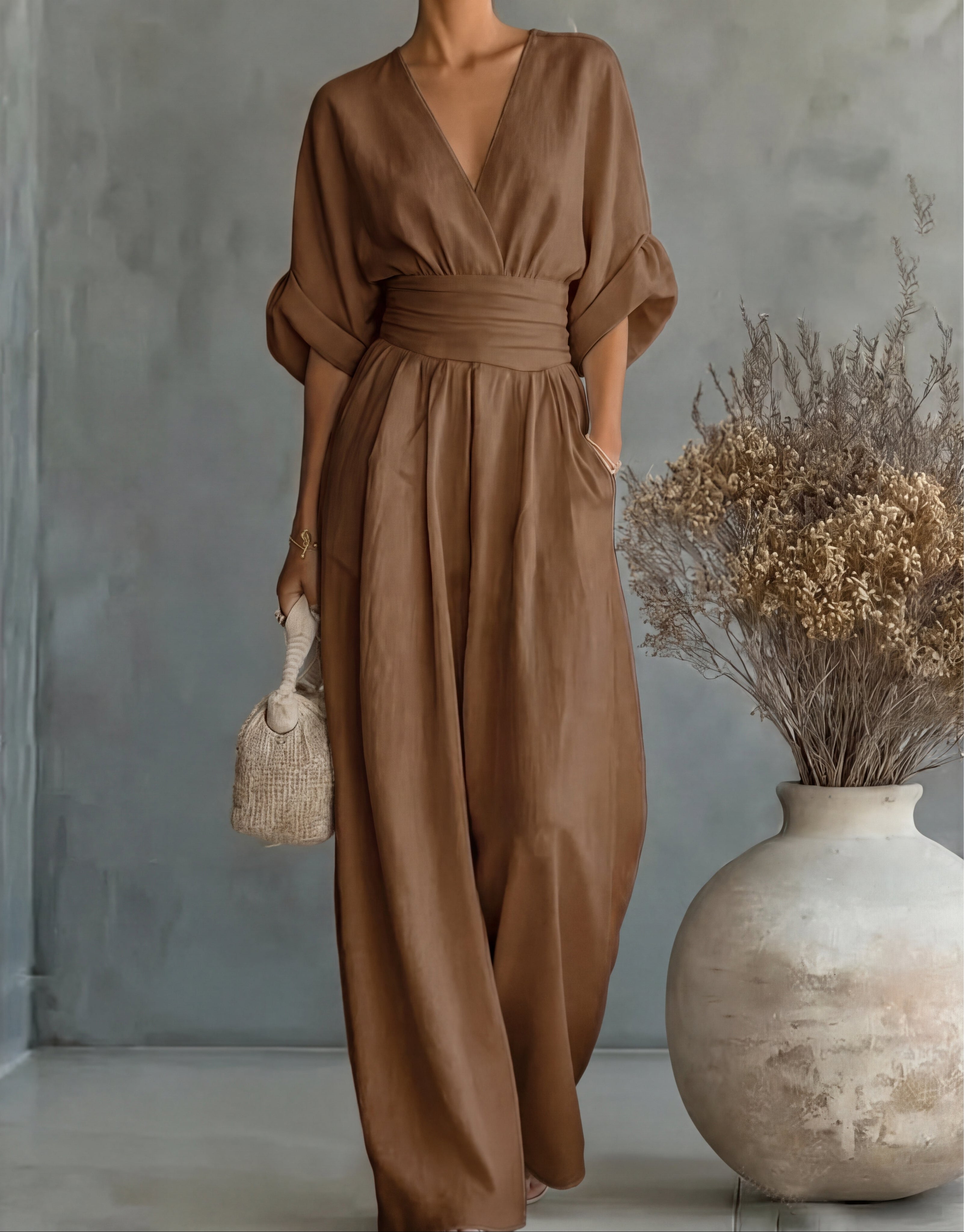 Women's wide-leg jumpsuit with V-neck and belted waist, elegant occasion wear