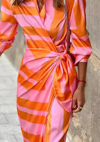 Women's long sleeve striped wrap dress with V-neckline and midi length