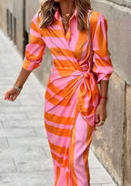Women's long sleeve striped wrap dress with V-neckline and midi length