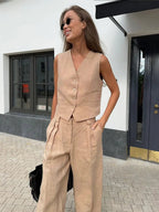 Women's linen two-piece set with wide-leg pleated trousers and button-up vest, summer