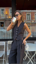 Women's linen two-piece set with wide-leg pleated trousers and button-up vest, summer