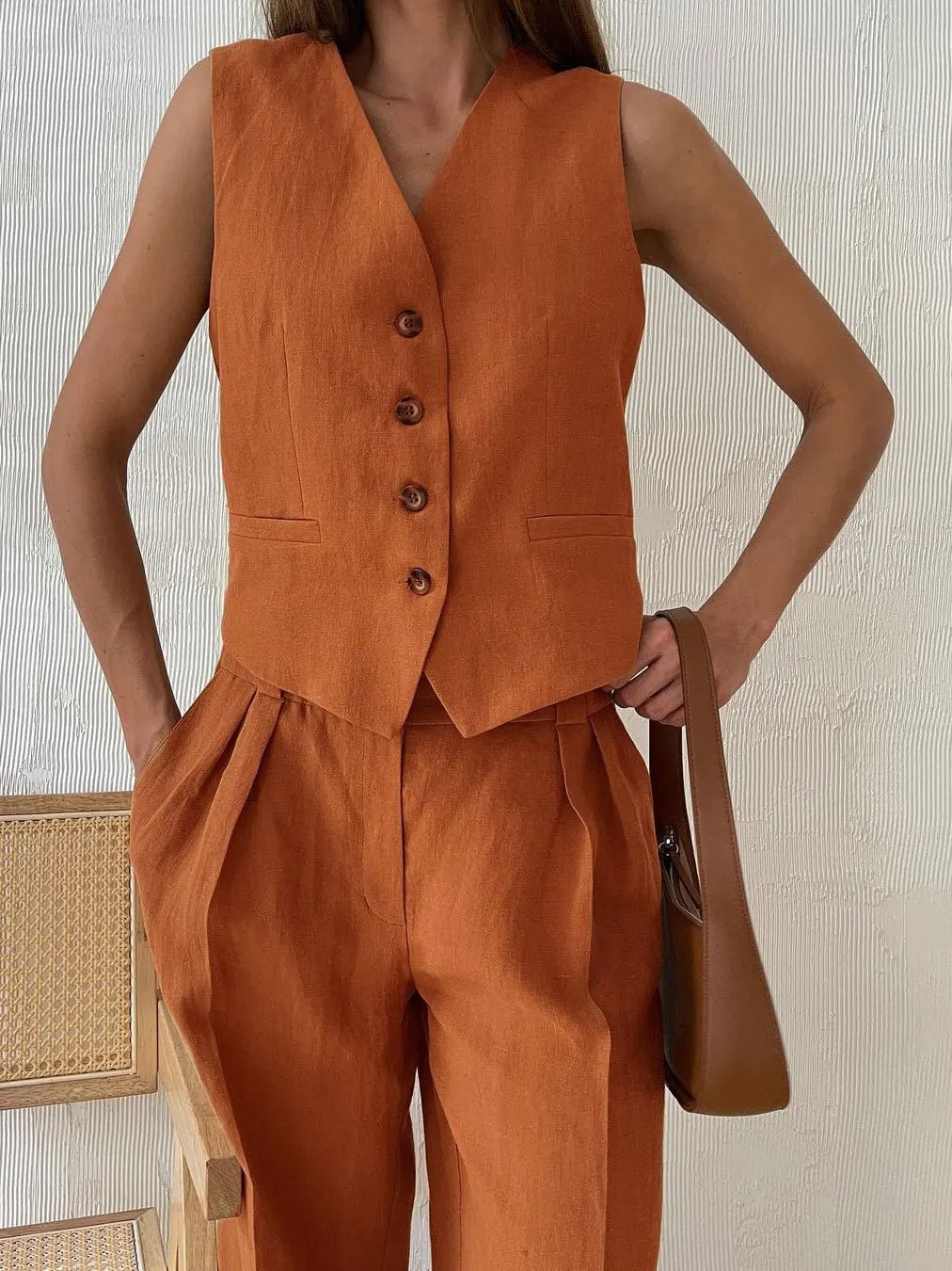 Women's linen two-piece set with wide-leg pleated trousers and button-up vest, summer