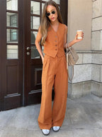 Women's linen two-piece set with wide-leg pleated trousers and button-up vest, summer