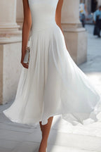 Women's sleeveless midi dress with cowl neck and pleated A-line skirt, wedding guest