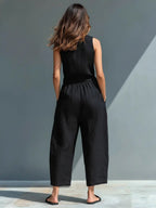 Women's sleeveless linen jumpsuit with stand collar and button-up front, relaxed fit