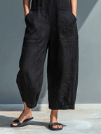 Women's sleeveless linen jumpsuit with stand collar and button-up front, relaxed fit